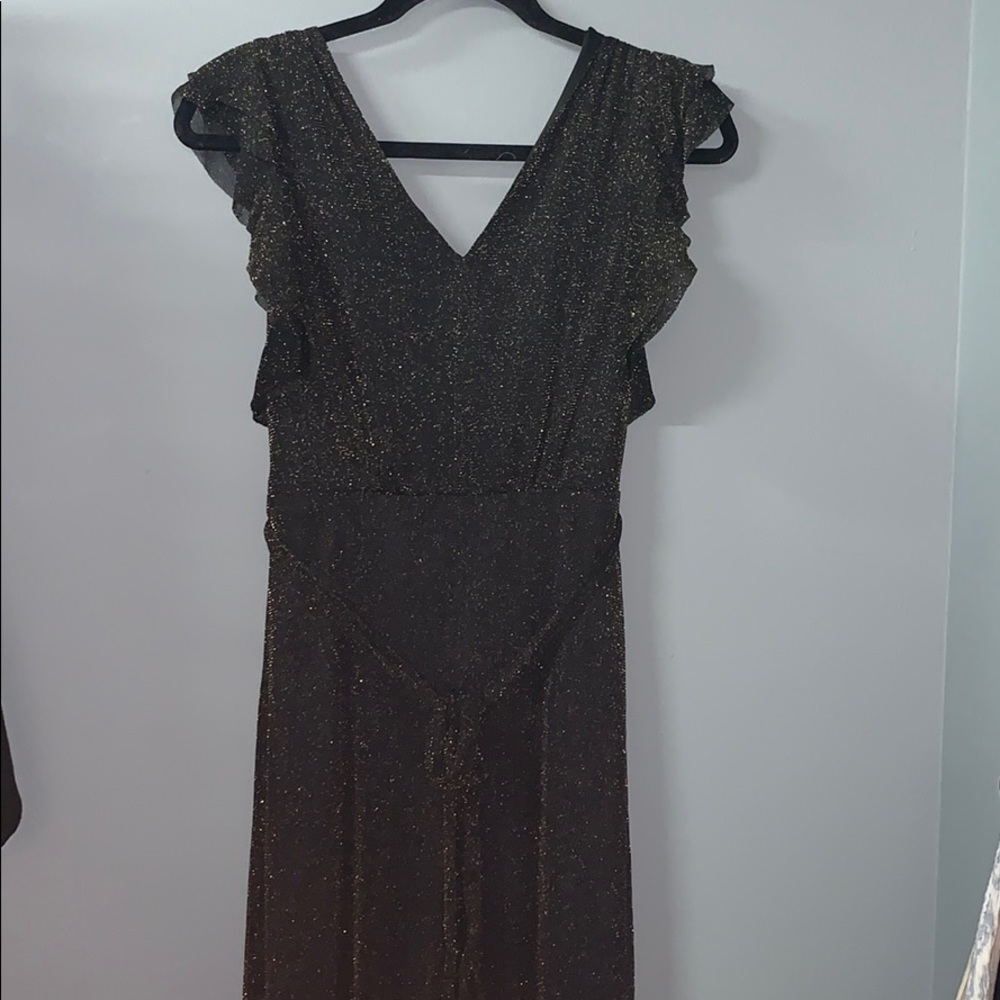 (Molly Green) A sparkly gold/brown dress.